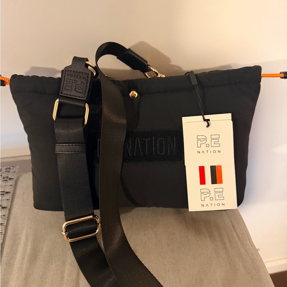 P.E Nation Black Messenger Bag with Orange Accents
